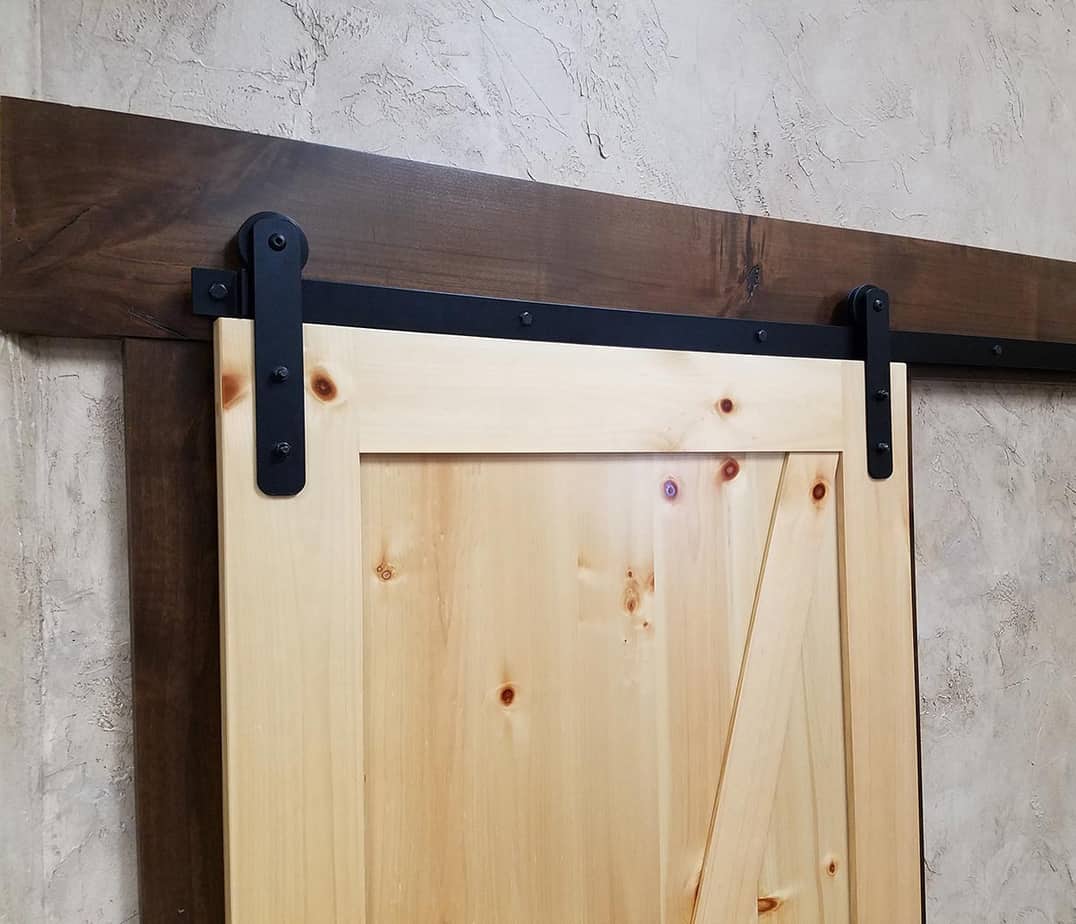 Goldberg Brothers MP Series Straight Strap Barn Door Hardware on a Pine Door